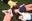 tee-shirt More Perpète enfant, en coton bio, porté par quatre enfants allongés au sol, dans les coloris jaune, creme, corail et marine