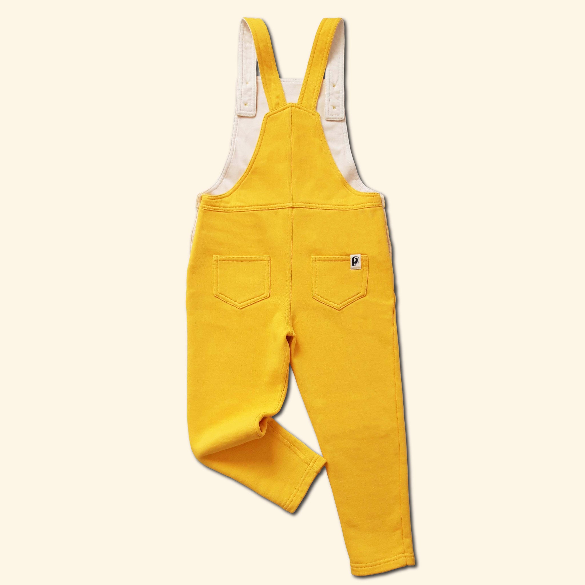 Salopette Shiny Perpète, mixte, en coton bio, coloris jaune, bretelles ajustables avec des boutons, à plat vue de dos